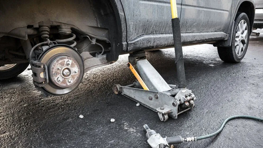 The vehicle was safely lifted with jacks to allow for chassis inspection.