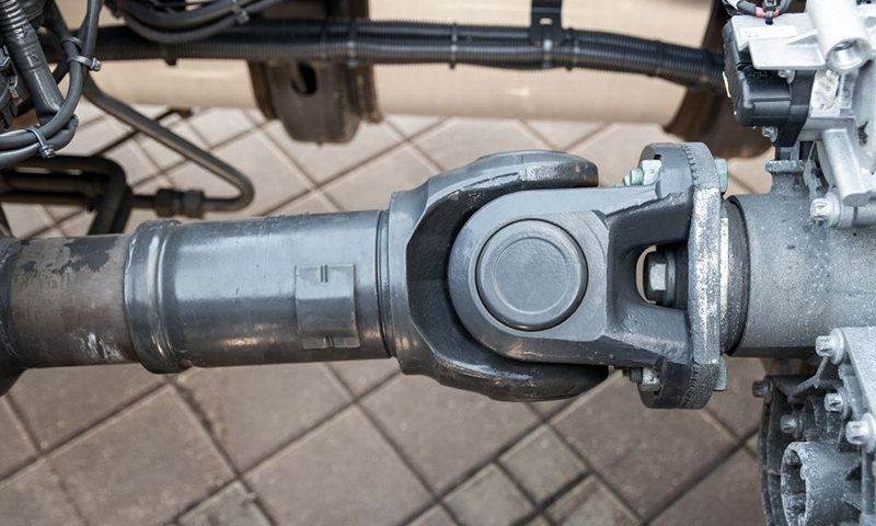 Weld yoke and universal joint installed on a driveshaft showing real driveline connection